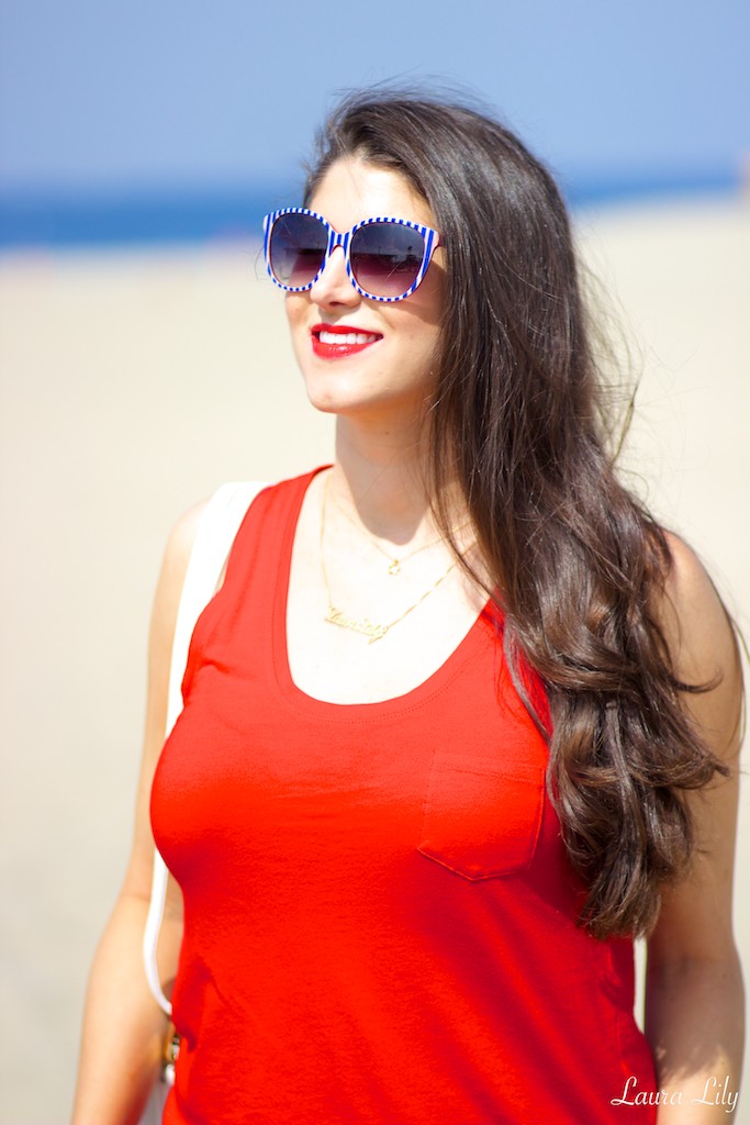 4th of July Outfit, cute outfit ideas for the 4th of July, LA Fashion Blogger Laura Lily, Red sleeveless Express top, Palm print Express shorts, Striped Chillibeans sunglasses, Bejeweled Lulu*s sandals, Personalized Onecklace, Gold Star Dogeared necklace, White studded ShopLately bag, 