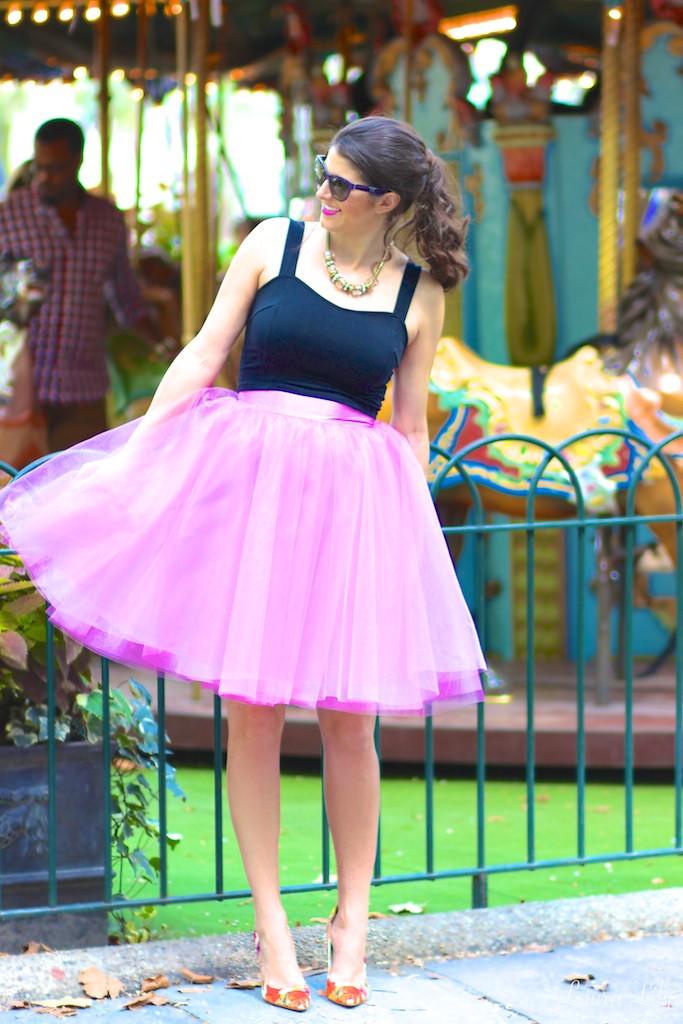 Bryant Park , Los Angeles Fashion Blogger Laura Lily, Bryant Park Carousel, Carrie Bradshaw style, Sex and the City tulle skirt, Space 46 Boutique Radiant orchid tulle skirt, purple prada cat eye sunglasses, floral Ivanka Trump Carra pumps, Carousel in Bryant Park,  