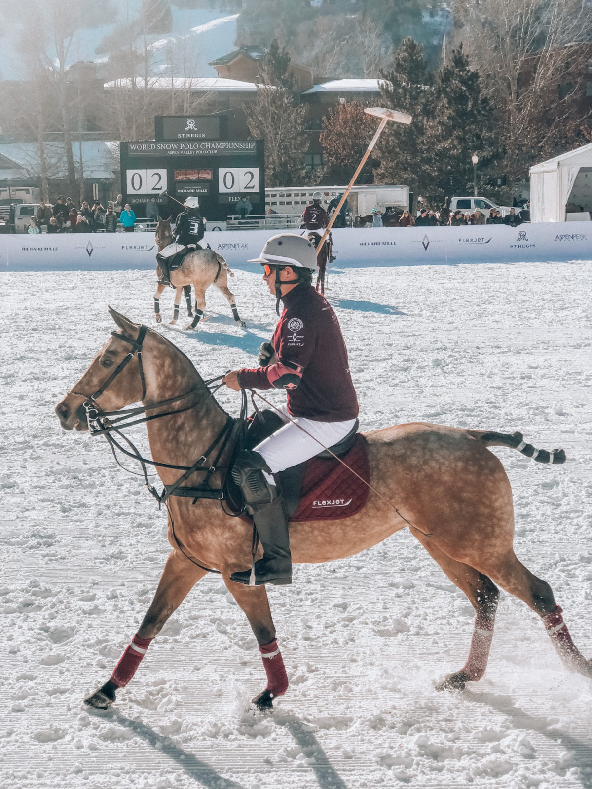 The Best St. Regis Aspen Travel Guide by featured by top Los Angeles Travel Blogger, Laura Lily : image of the Midnight Supper at the St Regis Aspen: image of a snow polo match