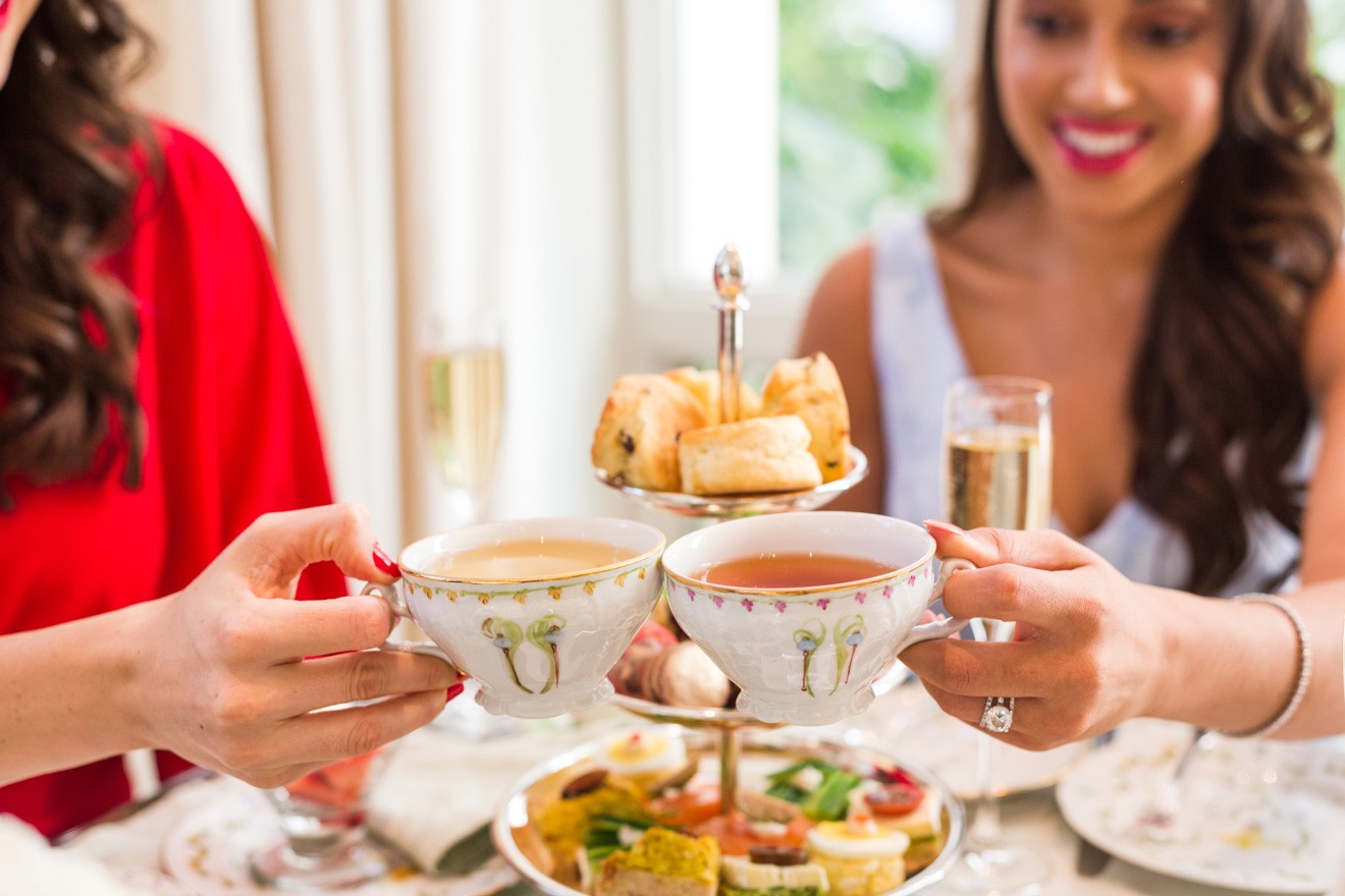 Tea Time at the Peninsula Beverly Hills Hotel review featured by top Los Angeles Travel Blogger, Laura Lily: image of 2 women having high tea at the Peninsula Beverly Hills hotel