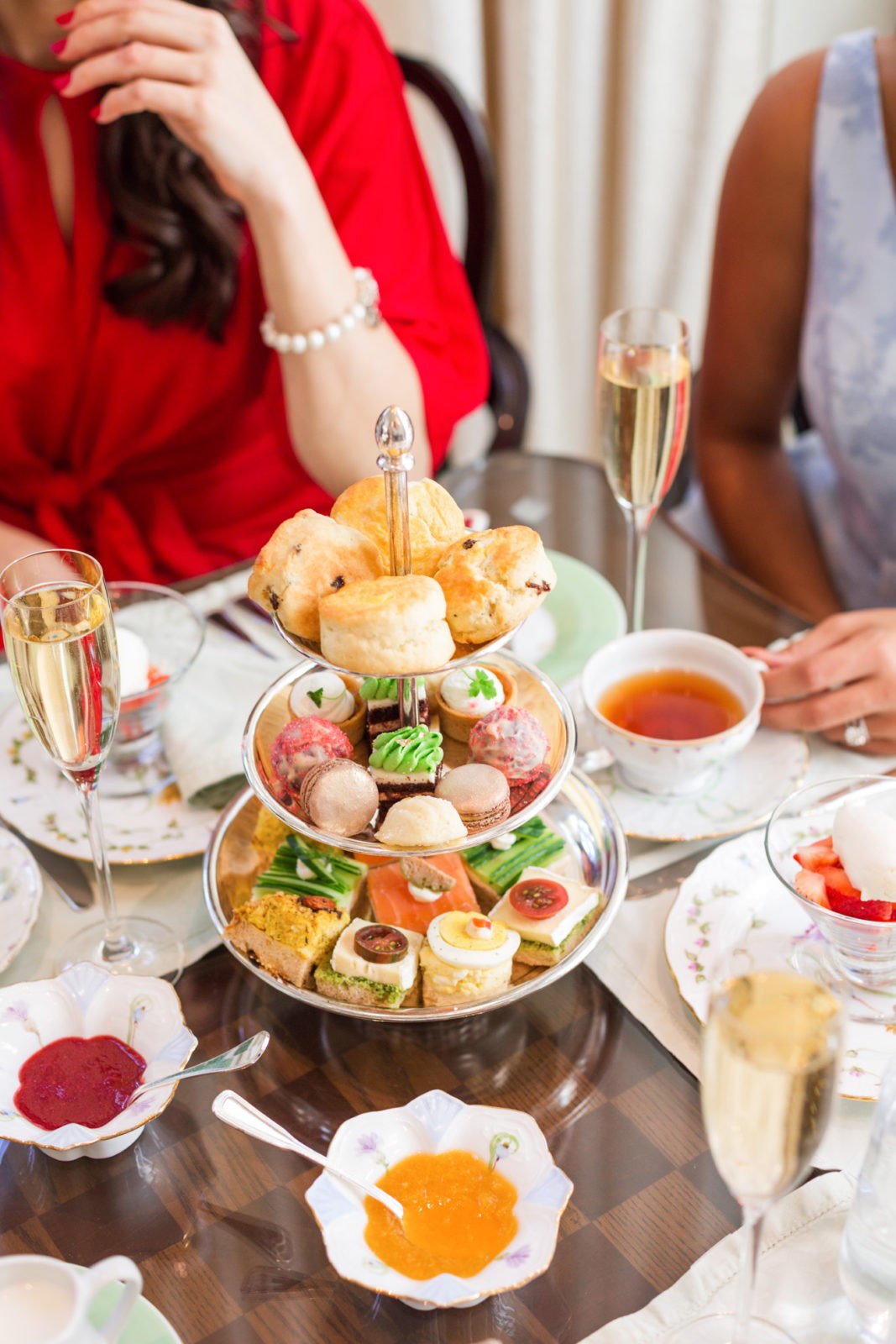 Tea Time at the Peninsula Beverly Hills Hotel review featured by top Los Angeles Travel Blogger, Laura Lily: image of 2 women having high tea at the Peninsula Beverly Hills hotel