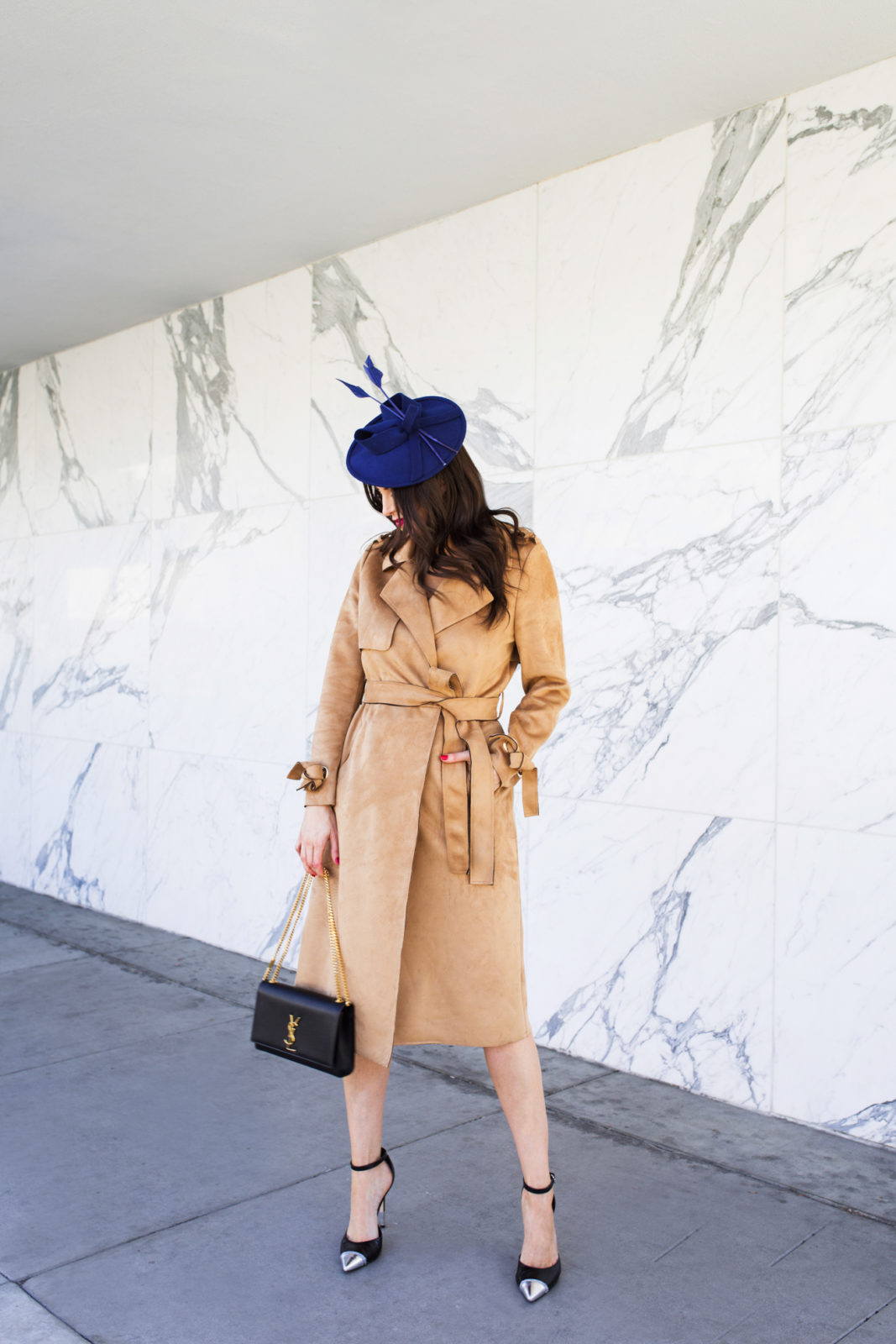 Top US fashion blogger, Laura Lily, features the best fascinators: image of a woman wearing a vintage blue fascinator, River Island trench coat, Yves Saint Laurent shoulder bag, and Schutz heels. | The Marvelous Mrs. Maisel Style, Suede River Island Trench Coat,