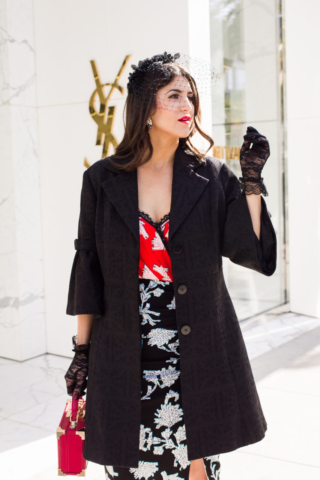 Romantic Date Night Dresses featured by top US fashion blogger Laura Lily; Image of a woman wearing DVF dress, Stuart Weitzman sandals, Asos Veil, vintage jacket, Izzy + Ali bag and Lace gloves from eBay.