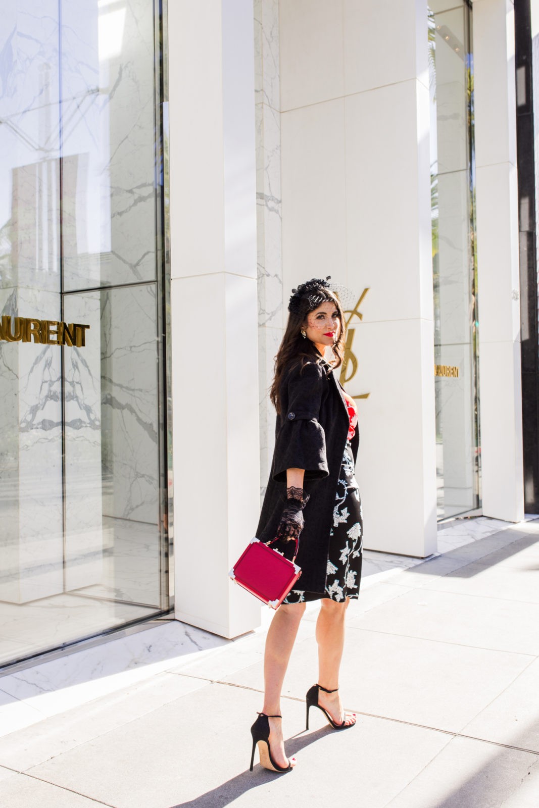 Romantic Date Night Dresses featured by top US fashion blogger Laura Lily; Image of a woman wearing DVF dress, Stuart Weitzman sandals, Asos Veil, vintage jacket, Izzy + Ali bag and Lace gloves from eBay.