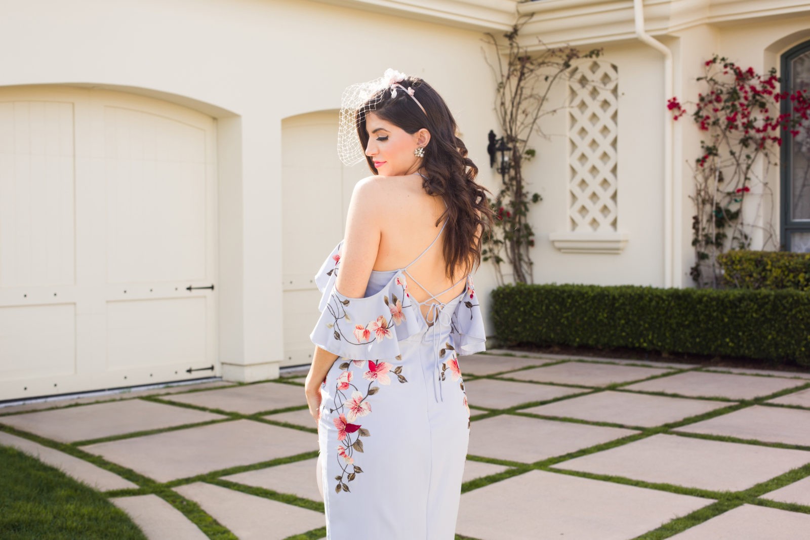 Spring Wedding Guest Dresses featured by top US fashion blogger Laura Lily; Image of a woman wearing an Asos dress, Asos Veil, Charles by Charles David, The Edit personalized handbag and J.Crew earrings.