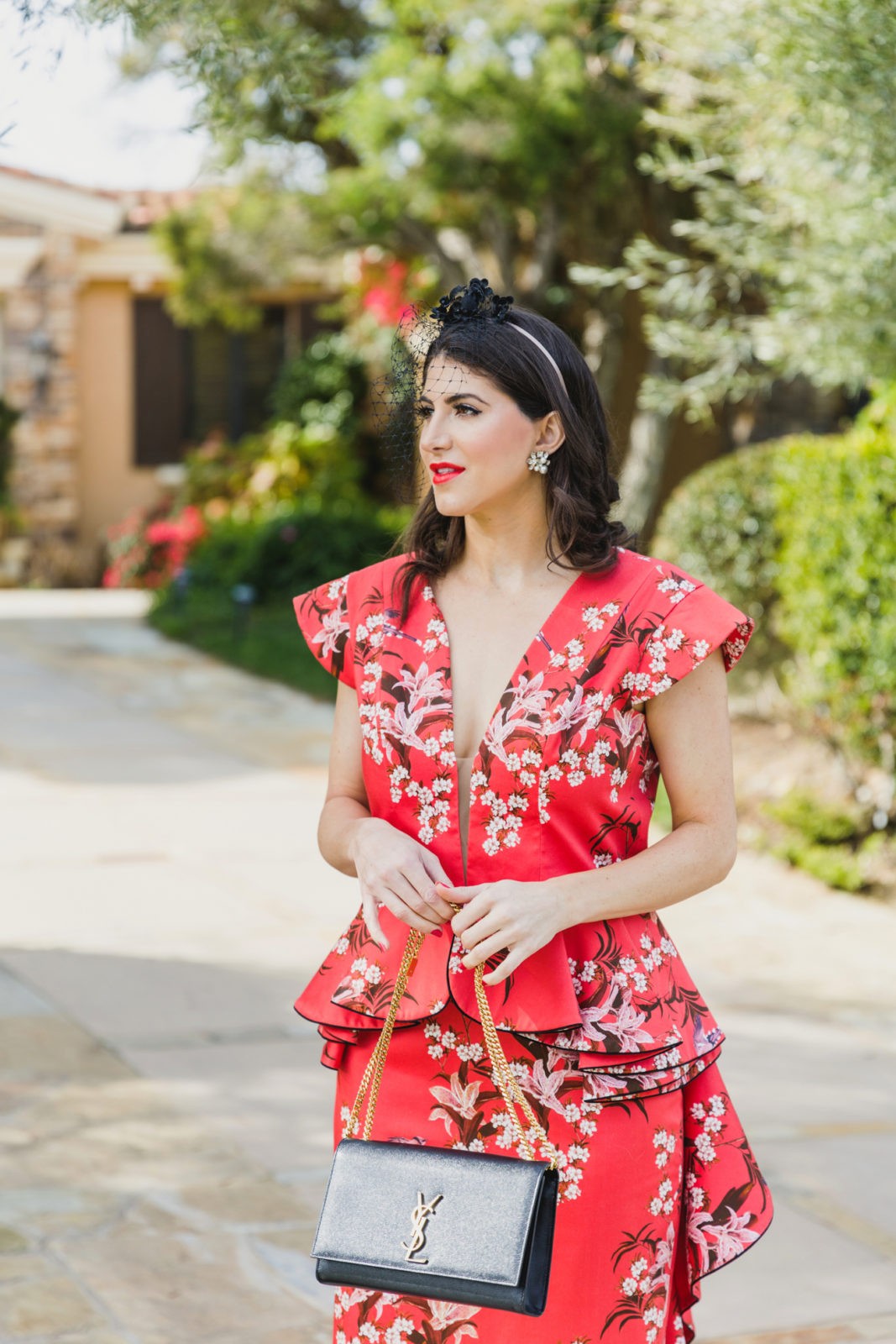 Floral Peplum Dress featured by top US fashion blogger Laura Lily; Image of a woman wearing a Joanna Ortiz Floral Peplum Dress.