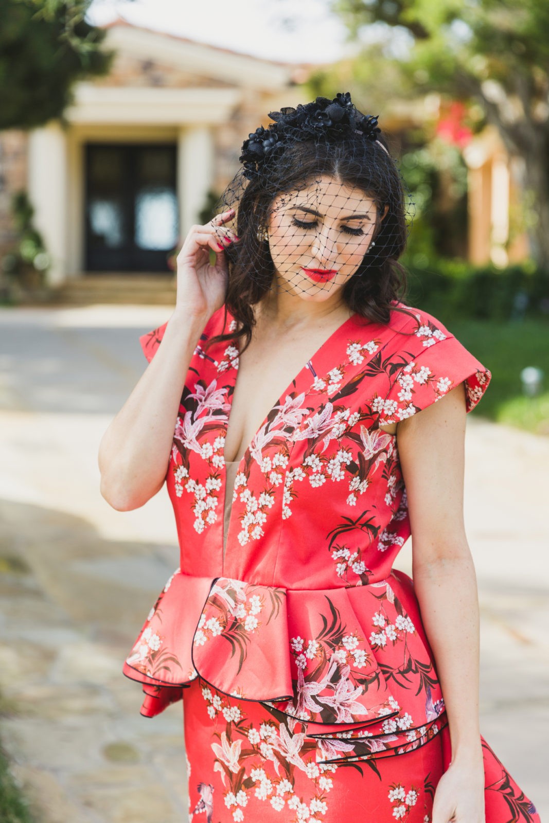 Johanna Ortiz Peplum Dress by Fashion Blogger Laura Lily, Red wedding guest dress ideas | Cute Headbands for Women by popular LA fashion blogger, Laura Lily: image of a woman wearing a black floral birdcage headband. 