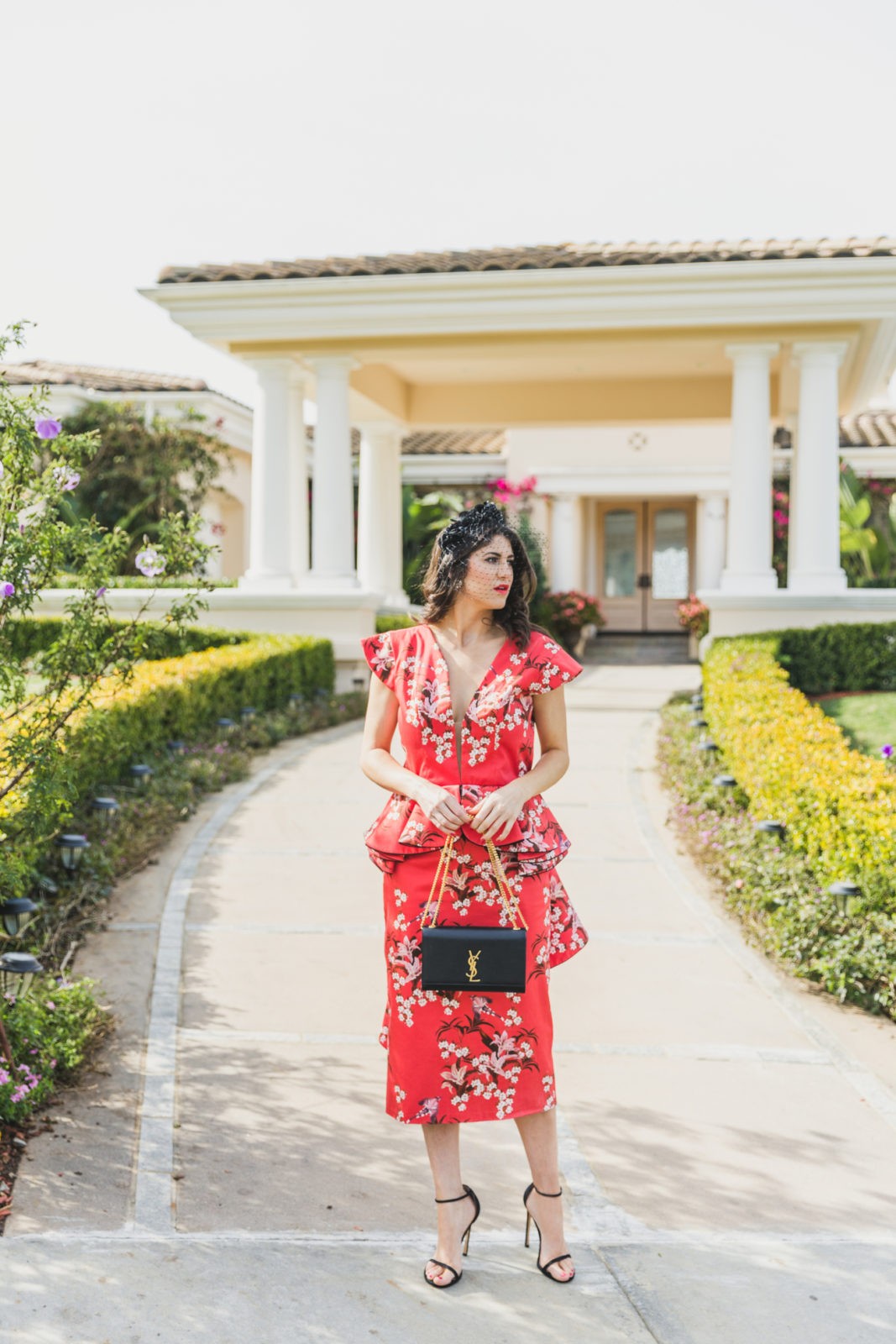 Floral Peplum Dress featured by top US fashion blogger Laura Lily; Image of a woman wearing a Joanna Ortiz Floral Peplum Dress.