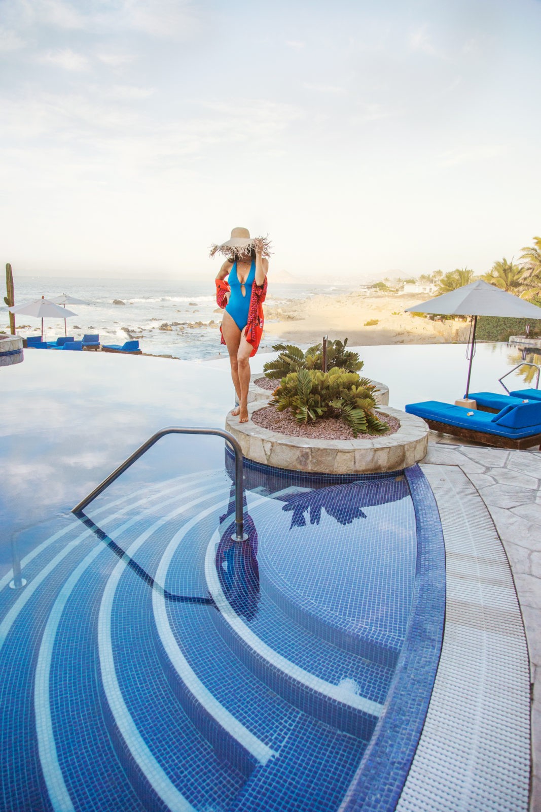 Hacienda Encantada Resort featured by top US travel blogger Laura Lily; Image of a woman wearing a blue swimsuit.