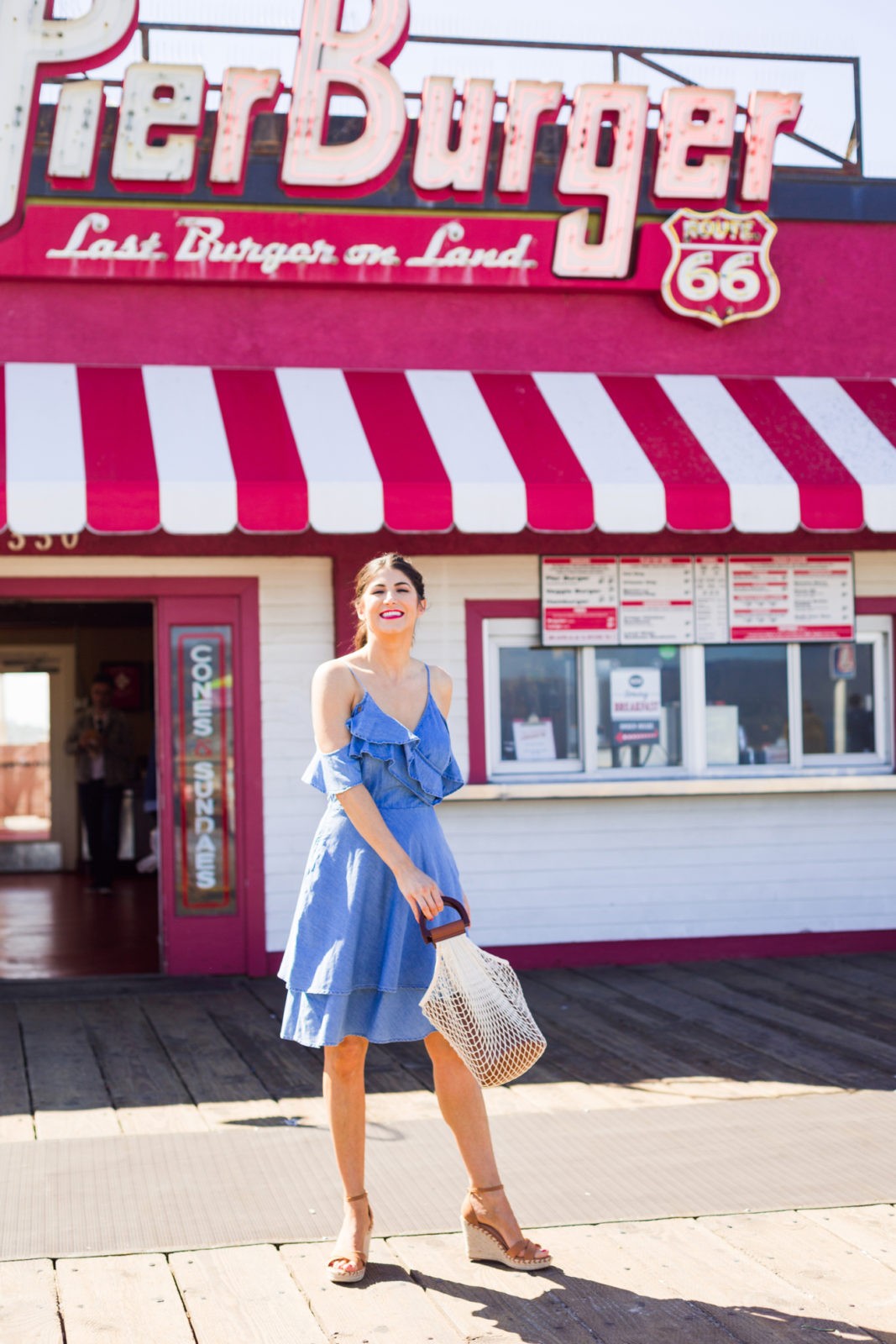 Summer Fashion Trends featured by top US fashion blogger Laura Lily; Image of a woman wearing ruffle midi dress from Walmart.