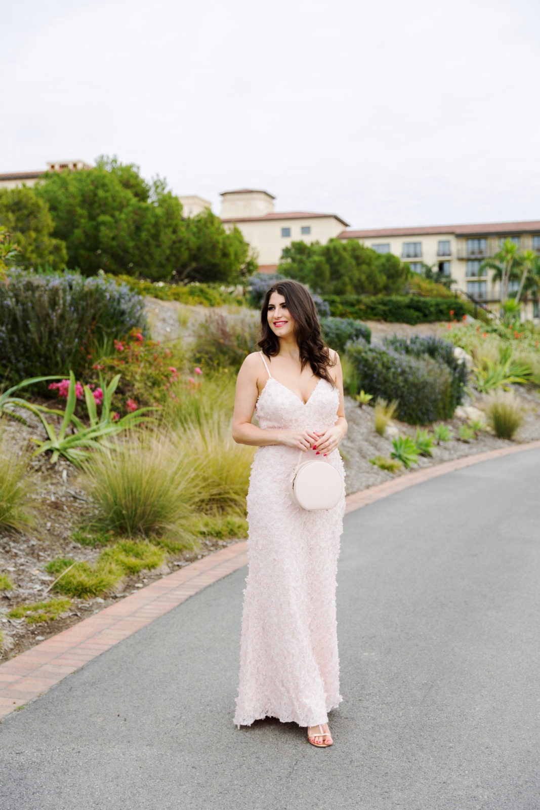 Bridesmaid Dress Ideas featured by top US fashion blogger Laura Lily; Image of a woman wearing Eliza J Dress, Asos Veil, Icing Earrings + headband, Lulu's heels and The Daily Edit bag.
