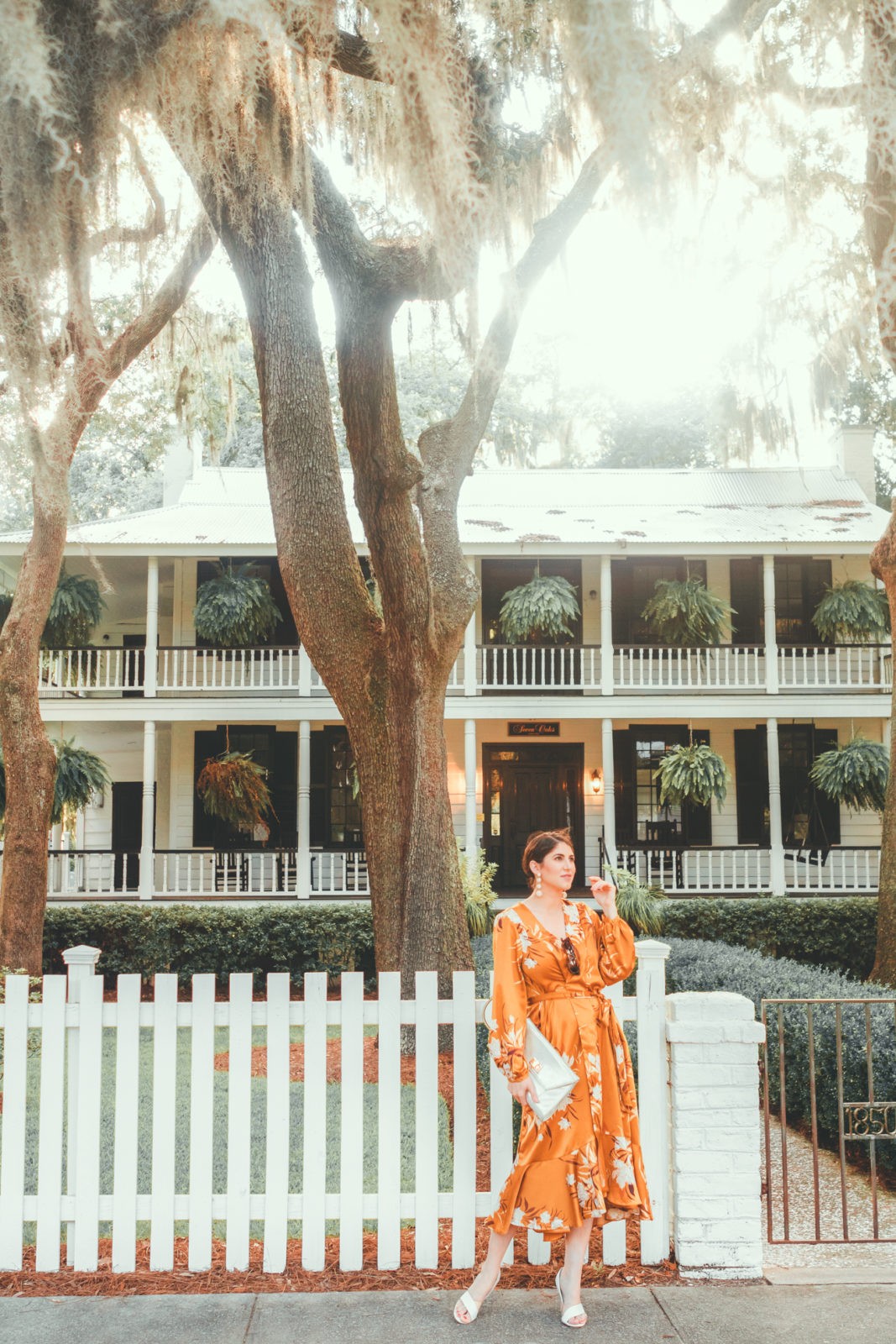 Montage Palmetto Bluff Resort Review by Luxury Travel Blogger Laura Lily: image of a woman standing outside on the groundsof the Palmetto Resort.