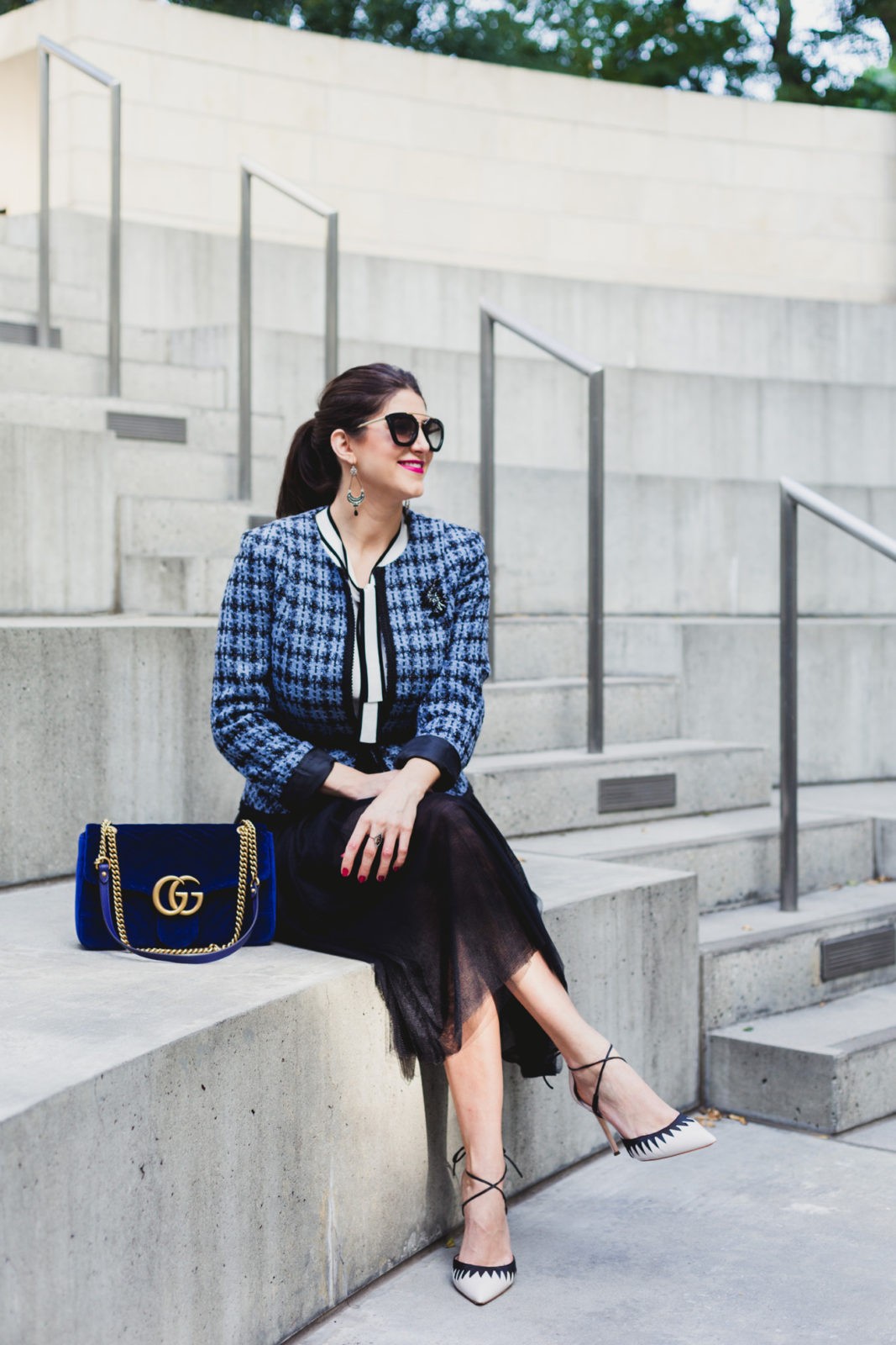 Must Have Fall Fashion Trends by Fashion Blogger Laura Lily, Blue Boucle Blazer, Blue velvet Gucci Marmont handbag, | Fall Fashion Essentials- Everything I am Coveting This Season by popular California fashion blogger, Laura Lily: image of a woman wearing a Blue Boucle Blazer and sitting next to a Blue velvet Gucci Marmont handbag. 