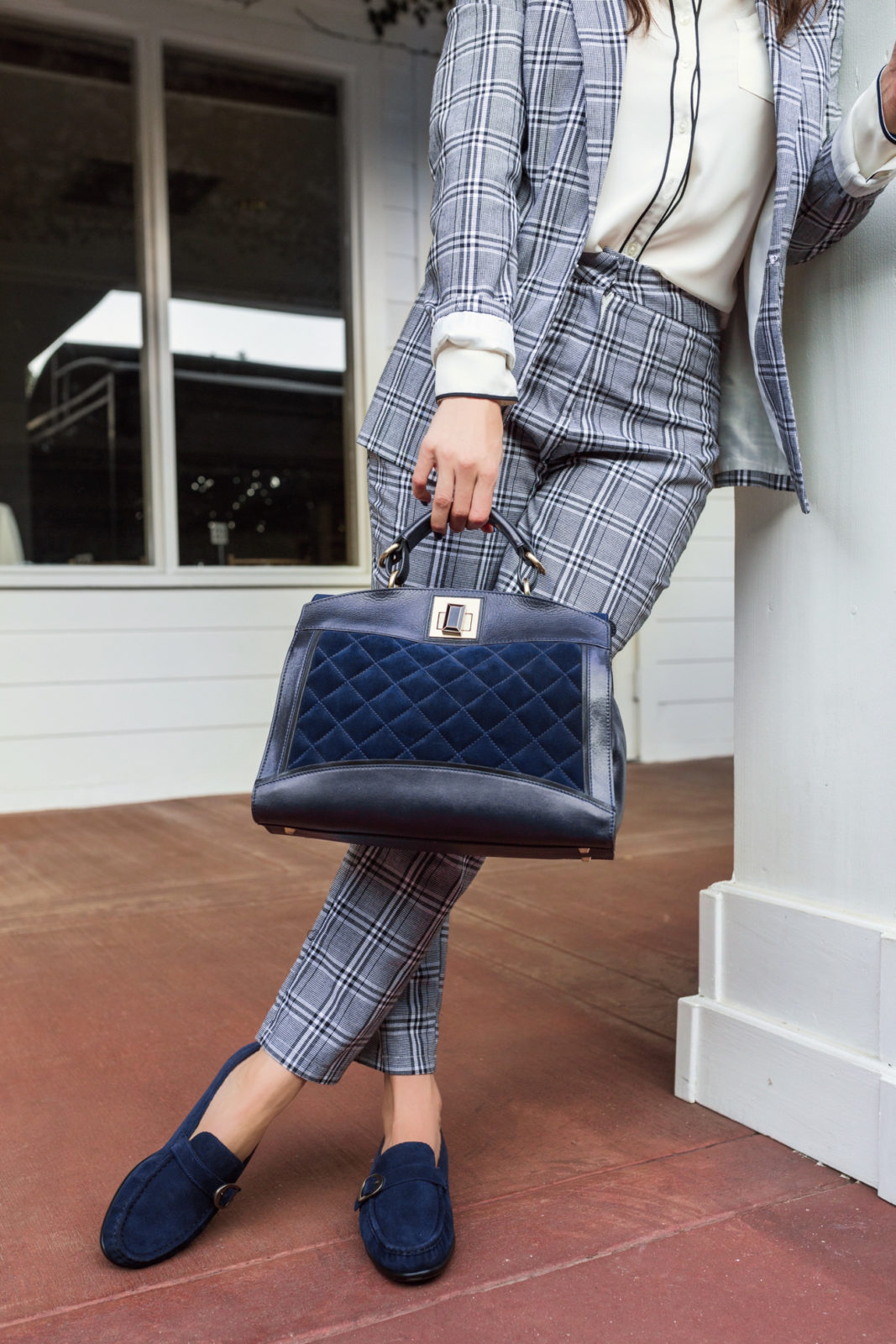 Borrowed from the Boys: Menswear Outfit Ideas for Ladies by Fashion Blogger Laura Lily | Borrowed from the Boys: Menswear for Women by popular California blogger, Laura Lily: image of woman standing outside and wearing a blue plaid suite, blue fedora hat, and Sas blue suede loafers. 