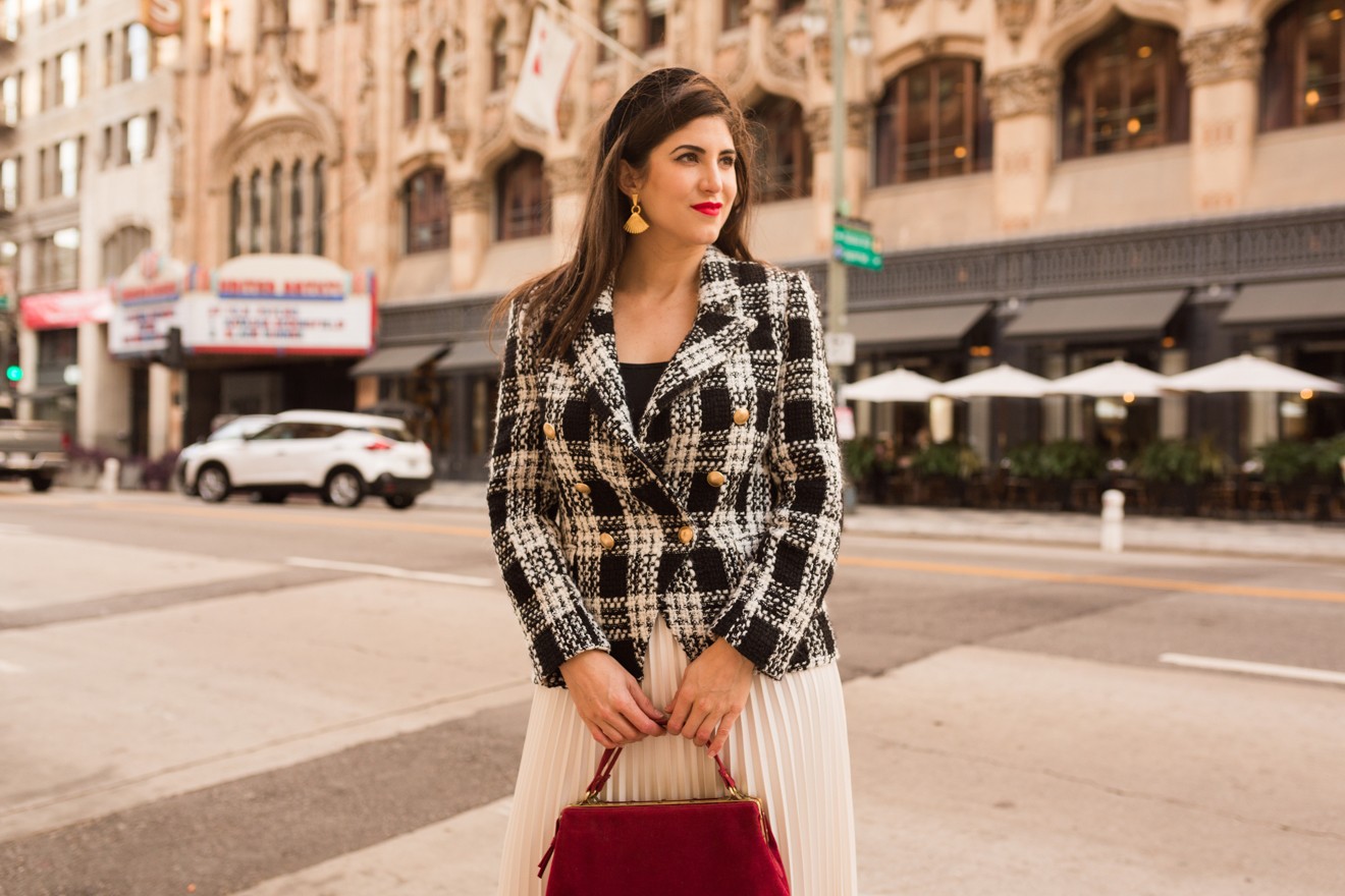 The Best Fall Work Blazers for Women featured by top US fashion blogger, Laura Lily: image of a woman wearing a L’Agence tweed blazer.