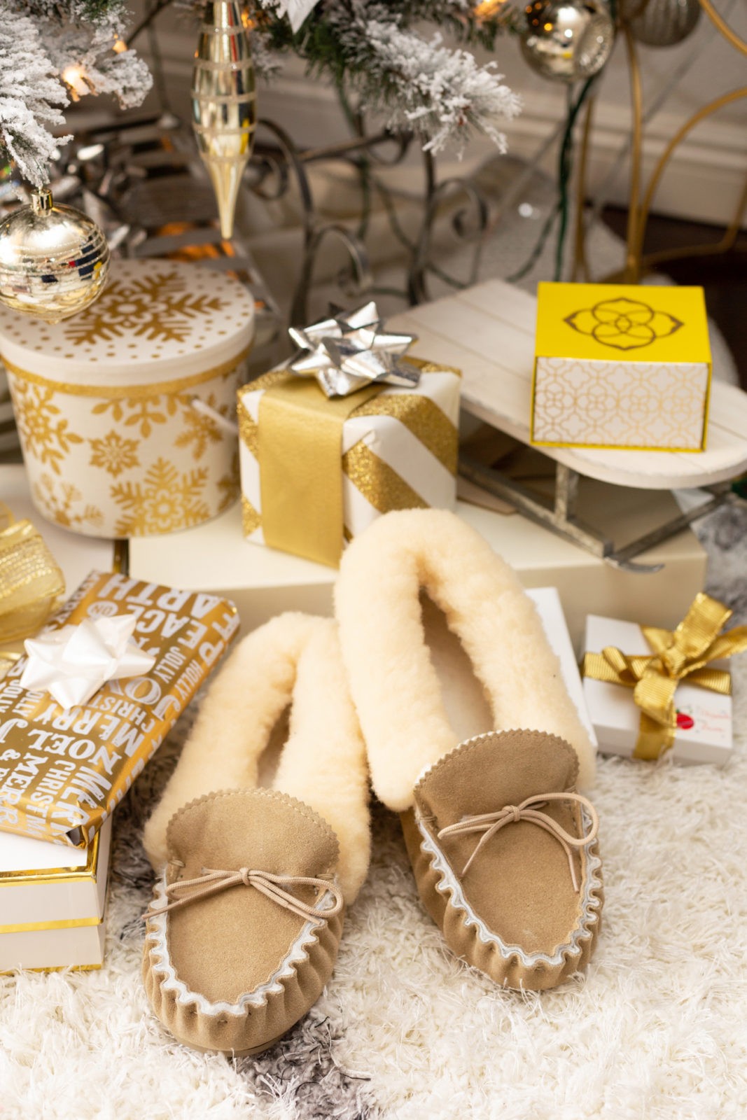 Gift Ideas for the Woman Who Has Everything by Lifestyle Blogger Laura Lily, Celtic & Co Shearling Sheep Slippers, Luxurious Gift Ideas for Her | Gift Ideas for the Woman Who Has Everything by popular Los Angeles life and style blogger, Laura Lily: image of a pair of Suede and Shearling slippers.