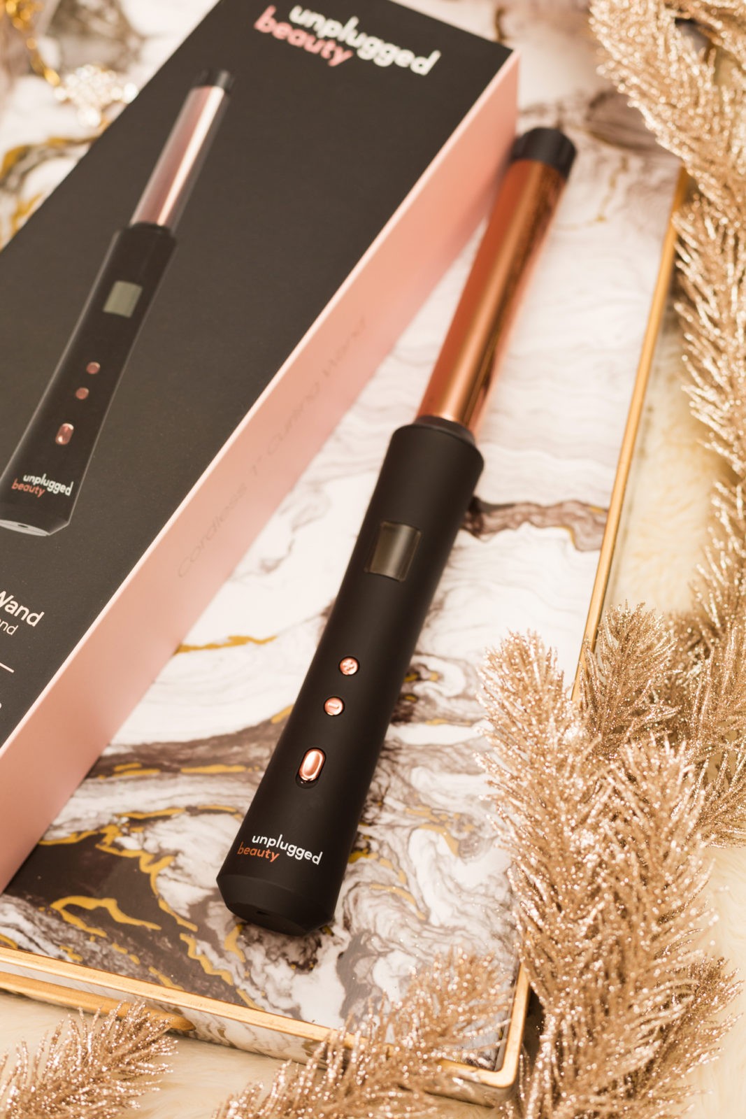 Gift Ideas for the Woman Who Has Everything by Lifestyle Blogger Laura Lily, Unplugged Beauty Cordless Curling Want, Luxurious Gift Ideas for Her | Gift Ideas for the Woman Who Has Everything by popular Los Angeles life and style blogger, Laura Lily: image of a Unplugged Beauty cordless curling wand.